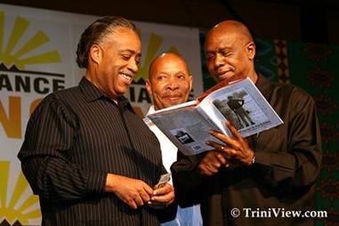 Al Sharpton is presented with a copy of Nelson Mandela's latest book 'A Prisoner in the Garden'